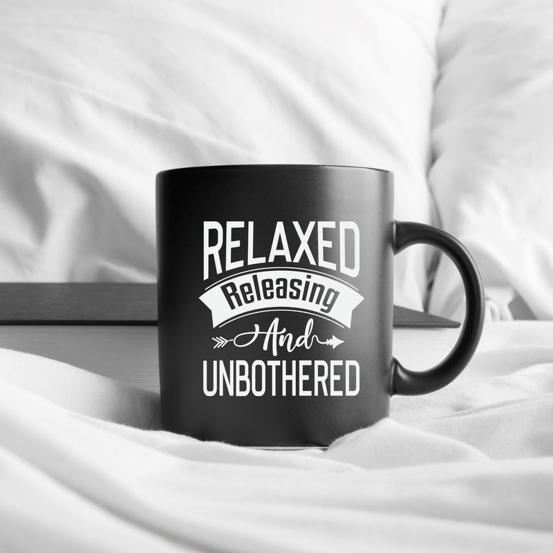 Relaxed Releasing and Unbothered 15 oz Black Glossy Mug Lifestyle by Suncera